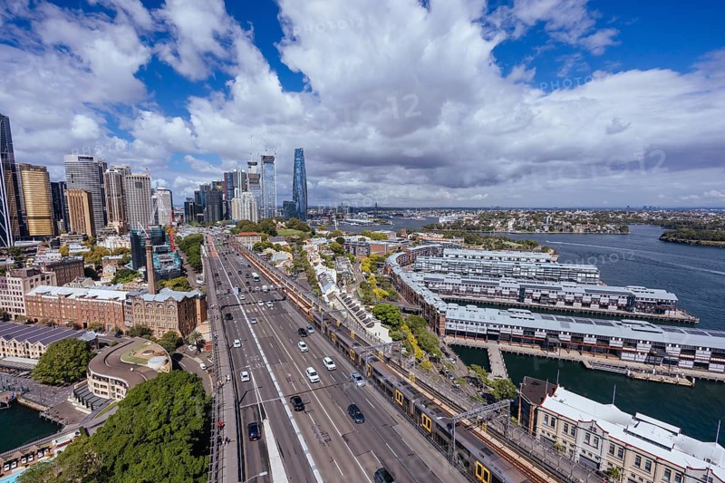 SYDNEY, AUSTRALIA, MARCH 4 2023: The Sydney CBD and surrounding harbour, including Circular Quay and The Rocks on a clear autumn day in Sydney, Australia, Oceania