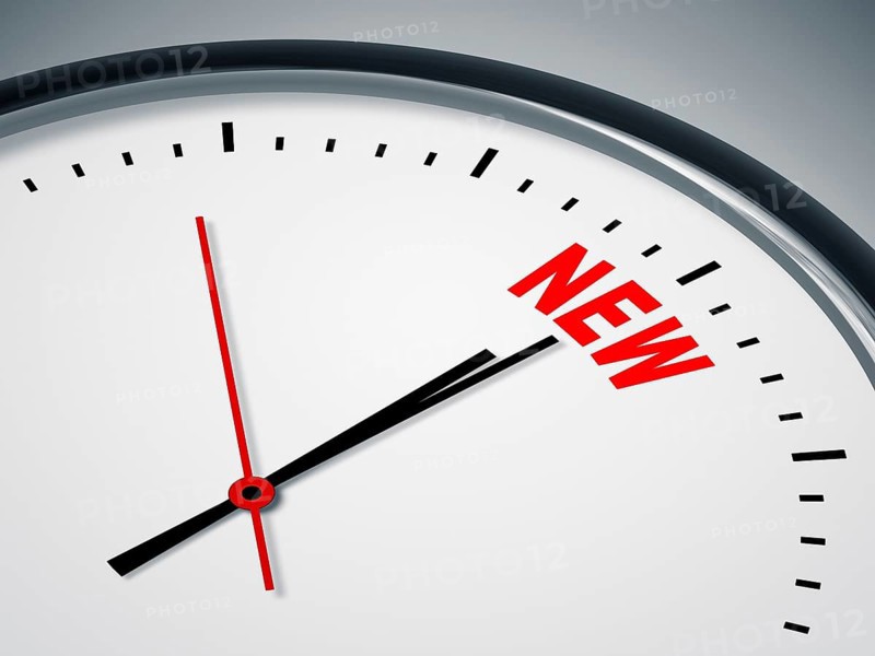 An image of a nice clock with the word NEW