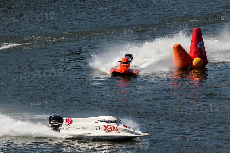 PESO DA REGUA, PORTUGAL - SEPTEMBER 15, 2024: Red and White Powerboats Go Fast with Splashes of Water during Race. Red Buoy. Formula 2 World Championship
