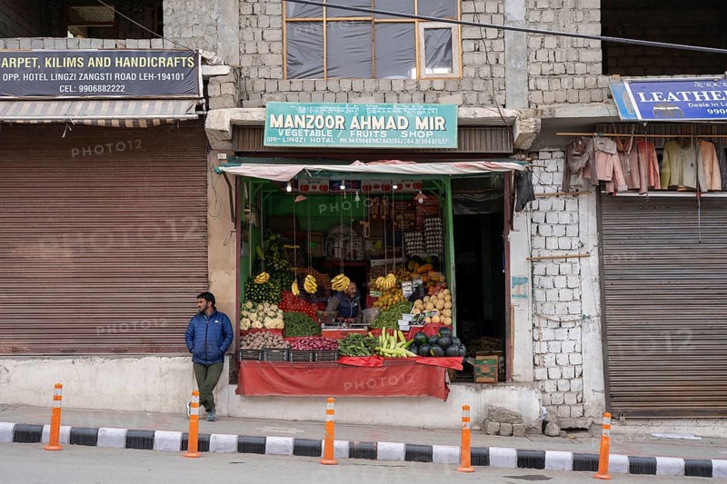Leh, India, April 4, 2023: People at a fruit and vegetable shop in the historic city centre, Asia