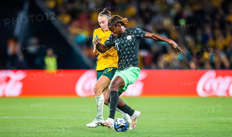 BRISBANE, AUSTRALIA, JULY 27: Caitlin FOORD of Australia and Christy UCHEIBE of Nigeria tackle as Australia plays Nigeria at the FIFA Women's World Cup Australia New Zealand 2023 at Brisbane Stadium on July 27, 2023