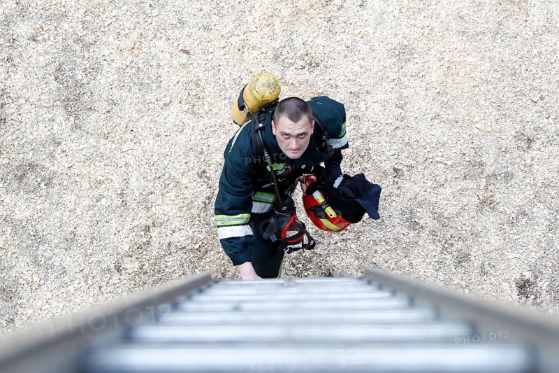 Belarus, Gomel, 04/06/2017, Extinguishing forest fire.Belarus.Firefighter will climb the stairs.Work firefighter. Extinguish the fire. Rescue work. Exercises of rescue workers, Europe