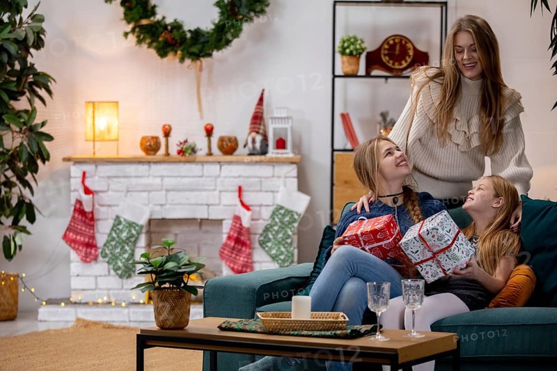 A heartwarming family scene of love, joy, and laughter as they celebrate Christmas together with gifts