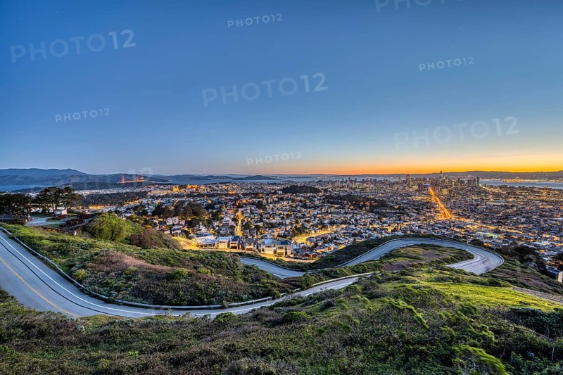 San Francisco with the Golden Gate Bridge in front of sunrise