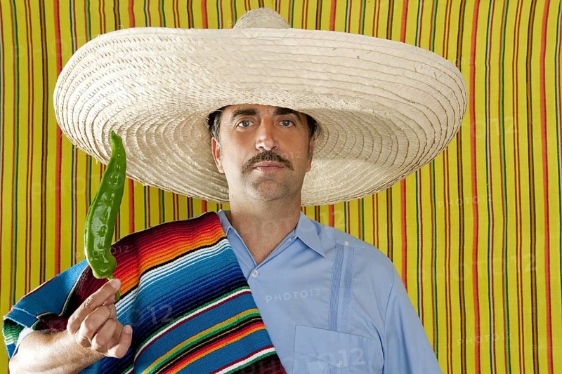 Chili hot pepper Mexican man typical poncho serape Mexico