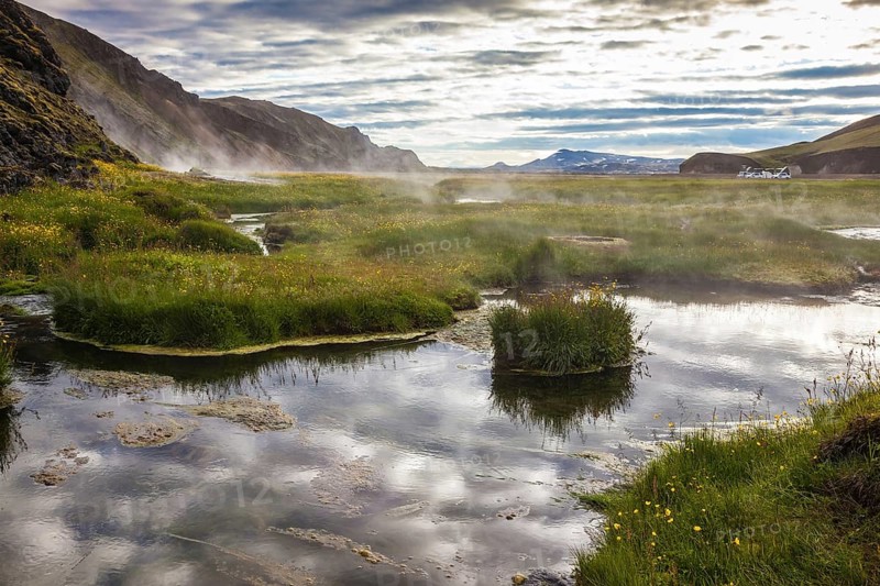 Sunrise Park Landmannalaugar. White nights in Iceland. Hot steam over the source of the thermal waters