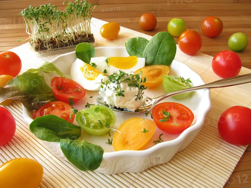 Cream cheese ball with cress, tomatoes and egg