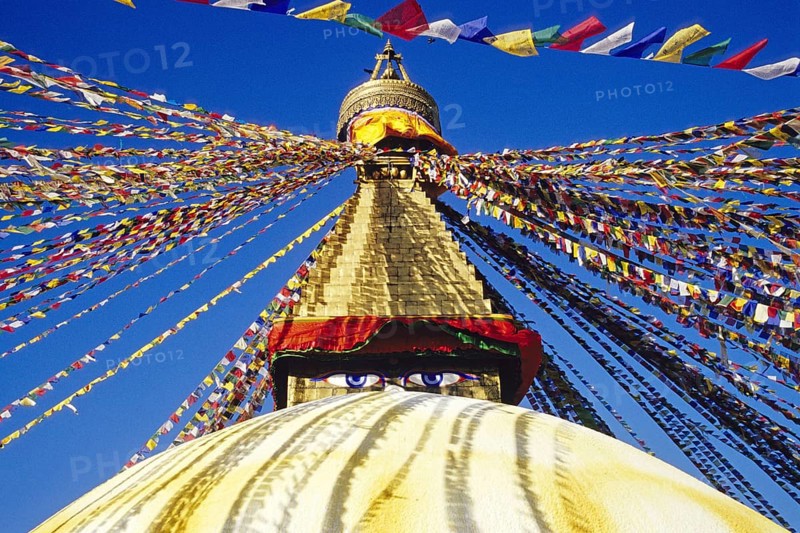 Bodnath Stupa in Nepal decorated with colourful flags