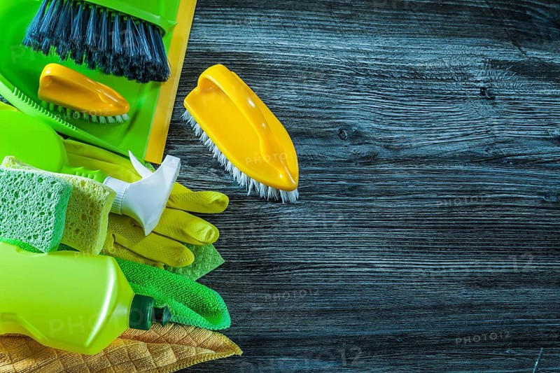 Dustpan brush washing objects on vintage wooden board