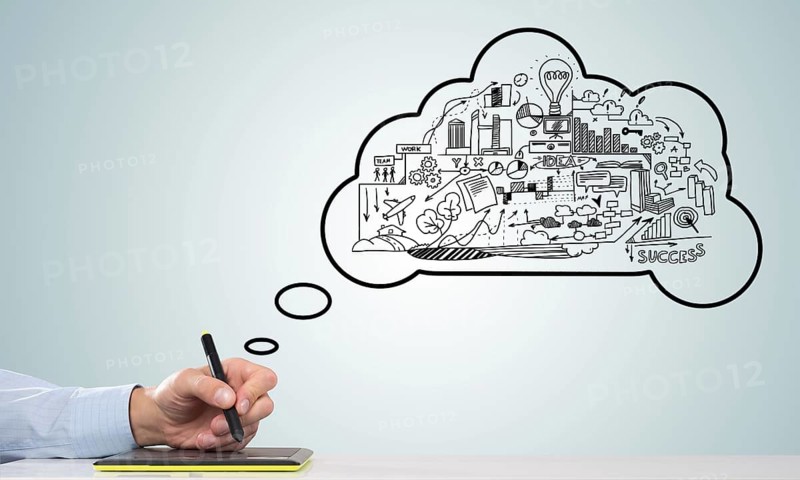 Hand of designer man working with tablet and business sketches at background