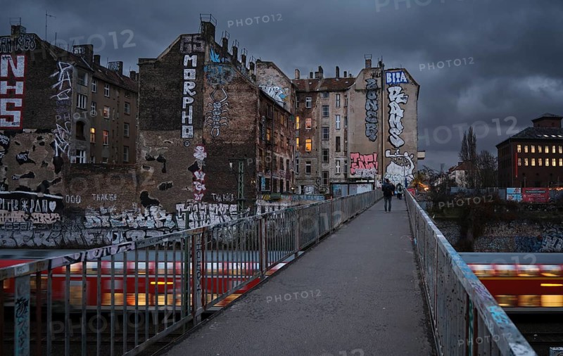 Germany, Berlin, 17.12.2024, View from Schönfließer Brücke, rear building gable Kopenhagener Straße, regional train, Europe