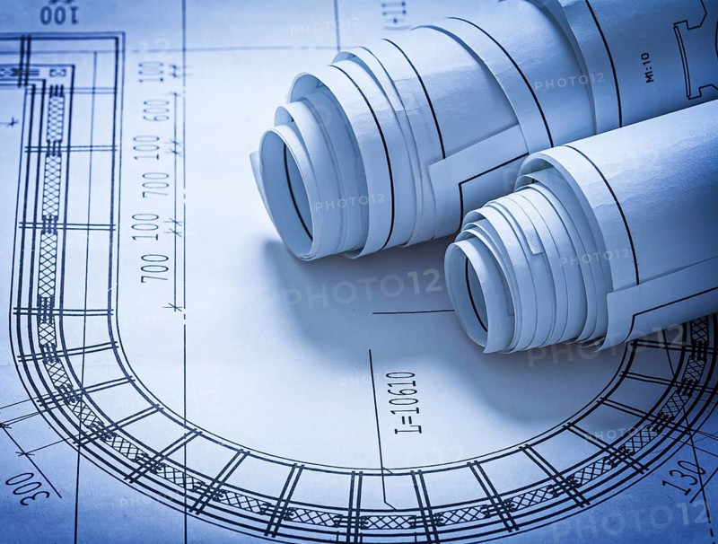Rolled up construction blueprints building concept