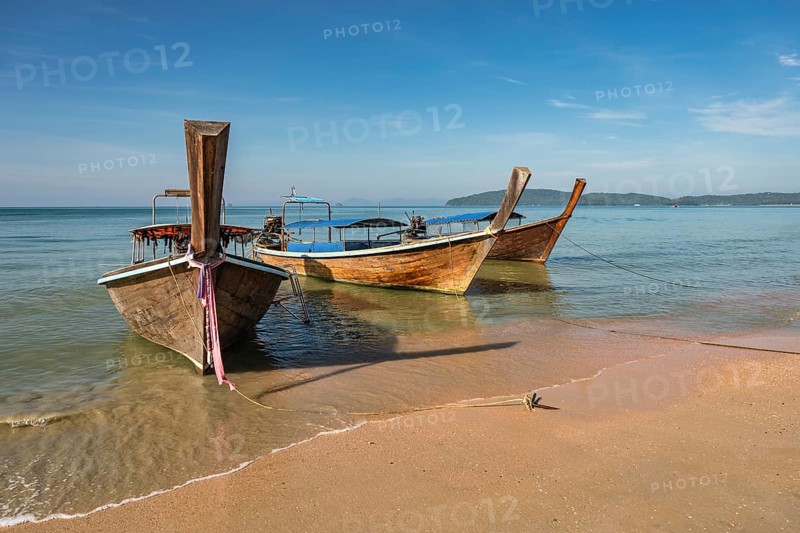 Tropical islands view with long tail boat ocean blue sea water and white sand beach, Krabi Thailand nature landscape