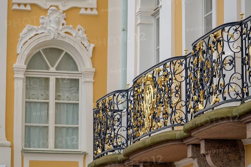 Detail of a richly decorated façade and ornate balcony railing on a historic building, saint petersburg, baltic sea, russia