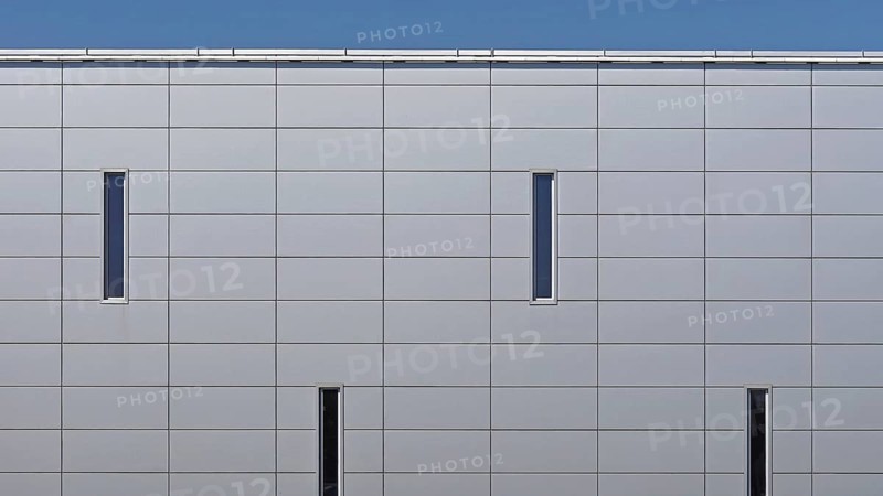 Grey metal panels at commercial building exterior