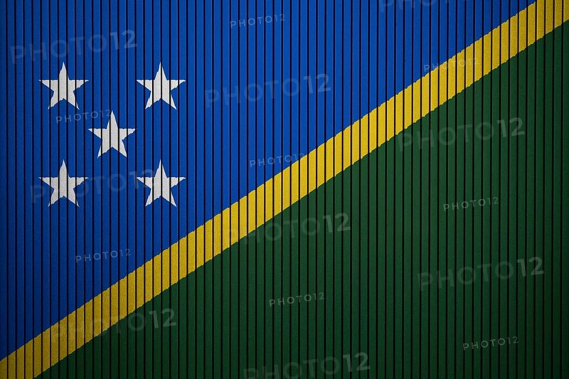 Solomon Islands Flag painted on the cracked grunge concrete wall