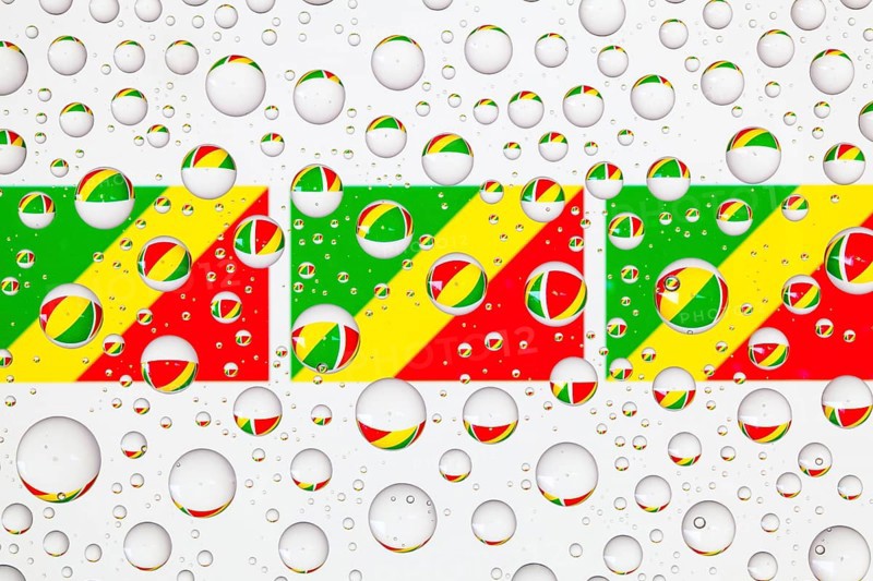 Flags of Congo behind a glass covered with raindrops. 3D illustration