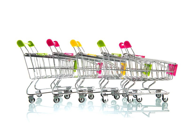 Row empty shopping carts isolated white background