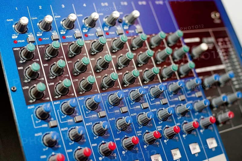 An audio control console, closeup, narrow focus