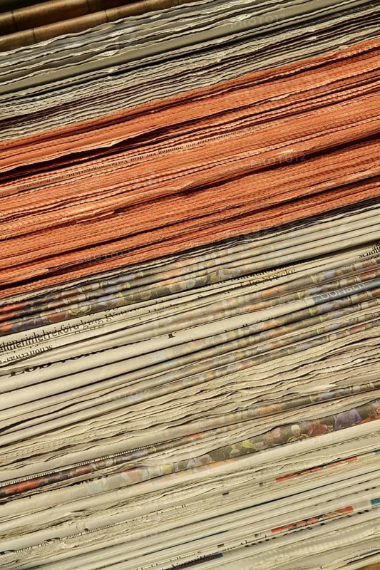 Stack of newspapers in the is intended to emphasise the importance of print media