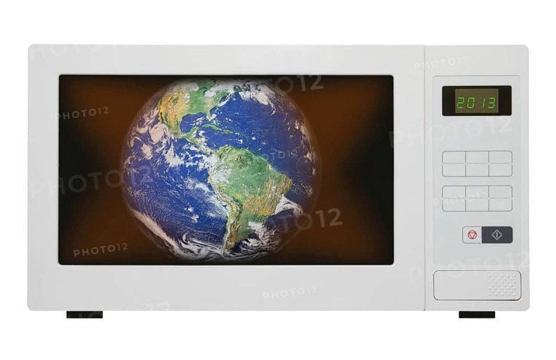 Global warming concept, earth in microwave