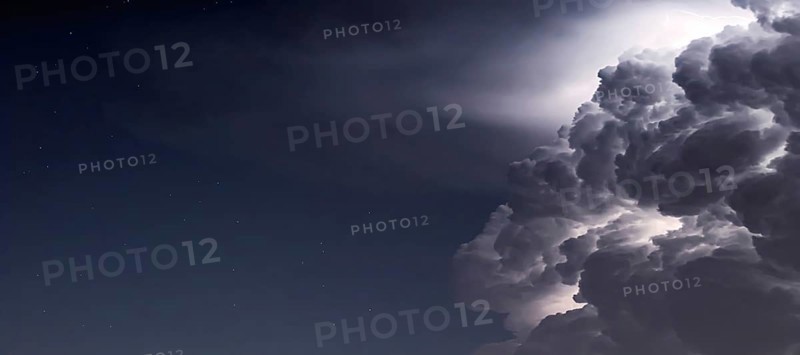 Dramatic Storm Clouds background. Lightning in the clouds. Night Clouds