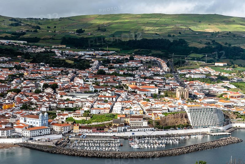 Angra do Heroismo, Portugal, July 1, 2022: Panoramic Aerial View of the old Town and the port of Angra do Heroismo from Monte Brasil, Terceira Island, Portugal, Europe