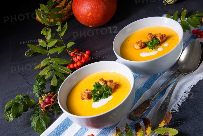 Delicious pumpkin soup with croutons and coconut milk