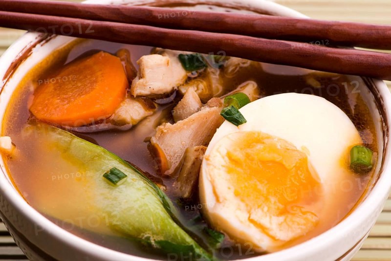 Ramen egg noodle soup dish with salmon fish