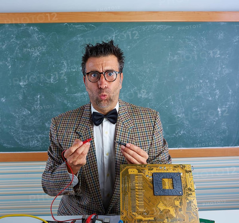 Nerd electronics technician retro teacher silly expression working in pcb
