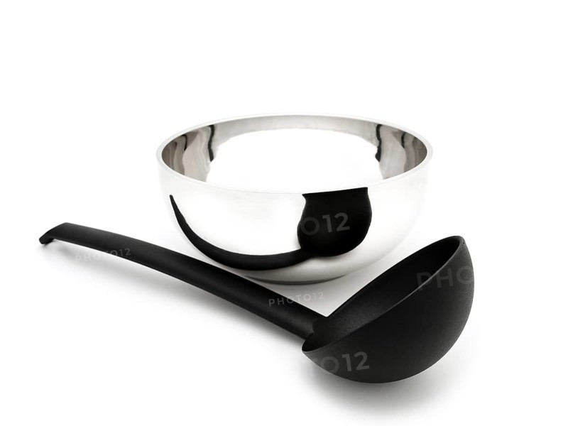 Soup Ladle Near the Metallic Bowl Against the White Background Riga, Latvia, Europe