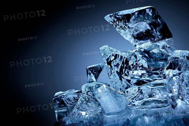 Frozen block of ice with blue tinted background