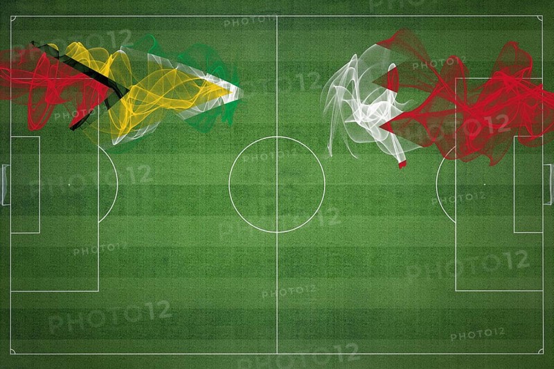 Guyana vs Bahrain Soccer Match, national colors, national flags, soccer field, football game, Competition concept, Copy space