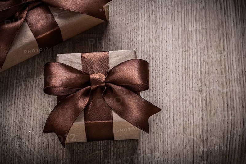 Present boxes with brown ribbons horizontal version celebration concept