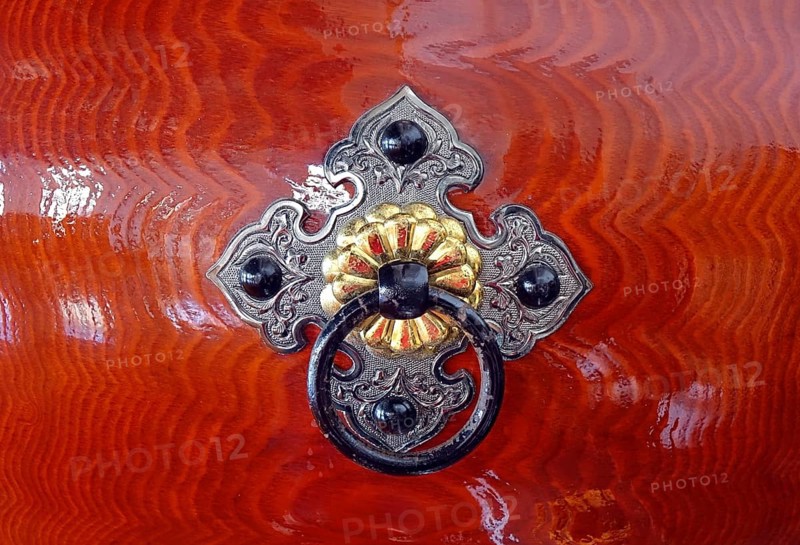 Silver color and brass color bronze fittings on a Japanese wooden Taiku drum