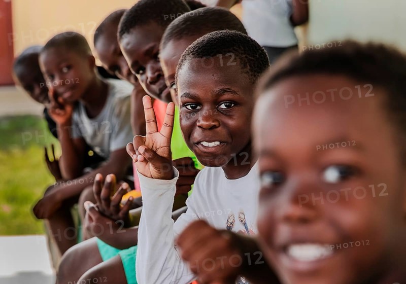Children making a peace sign with their hands. Snapshot. It was taken during a rubbish collection project in a social housing community. Recycling.Libreville, Gabon, Africa