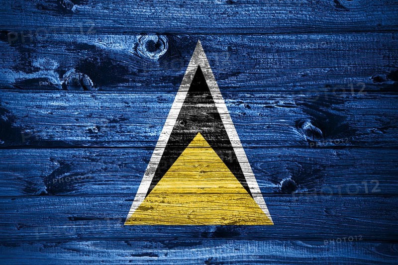 Saint Lucia flag on wooden planks background wood flag