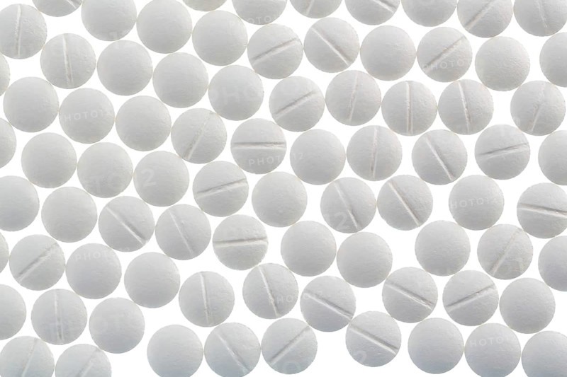 White tablets, symbolic photo for medicine, remedies and tablet addiction Austria