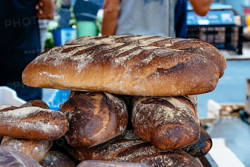 Traditional french bread in the stall at the market in Dinan