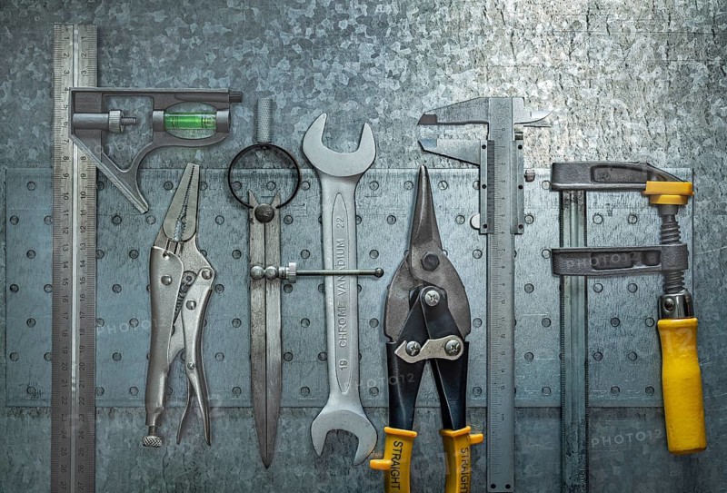 Set Of Construction Tools On Metalic Background