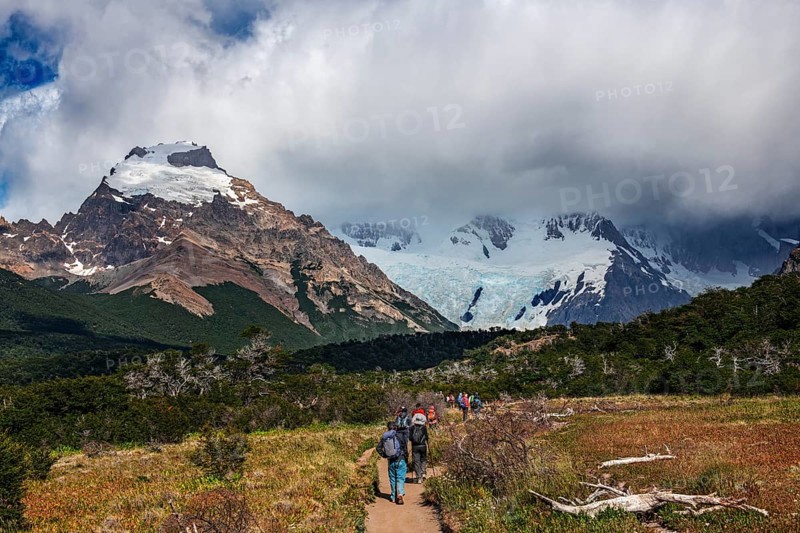 Trekkers at Cascada Martin with a view of the Fitzroy Massif, El Chaltén, Los Glaciares National Park, Santa Cruz, Patagonia, Argentina, South America