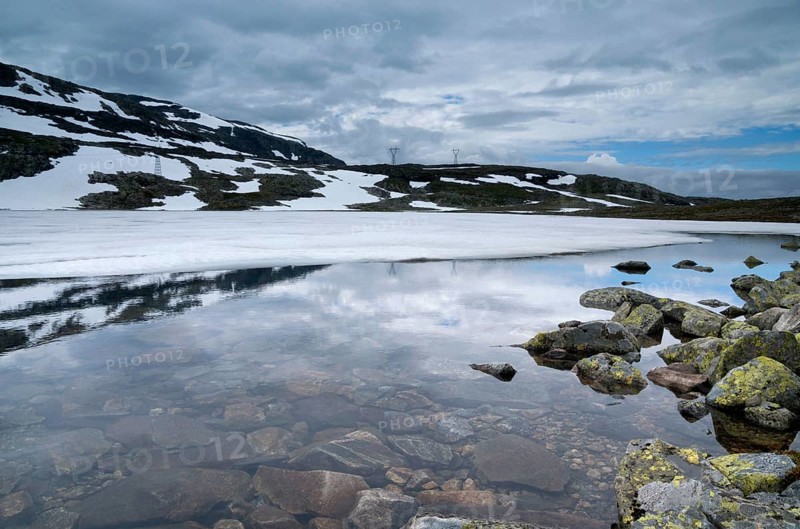 Mountain top reflecting in a lake on the Norwegian Aurlandsfjellet