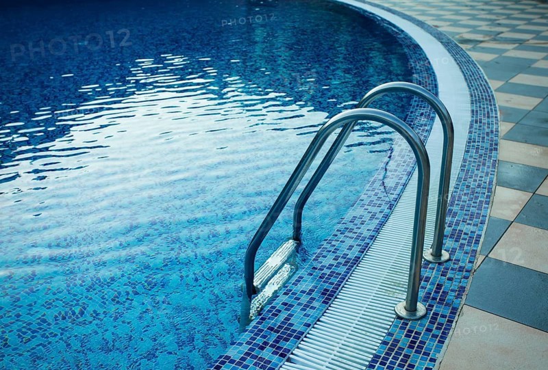 Swimming pool in the resort. View from water