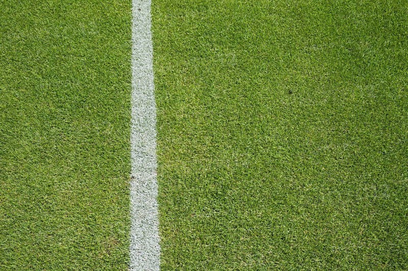 White line on the grass at soccer playing field in Lubin, Poland, Europe