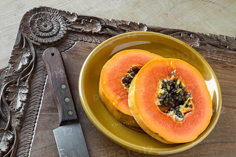Pawpaw slices on a walnut tray (Kashmir, hand-carved)
