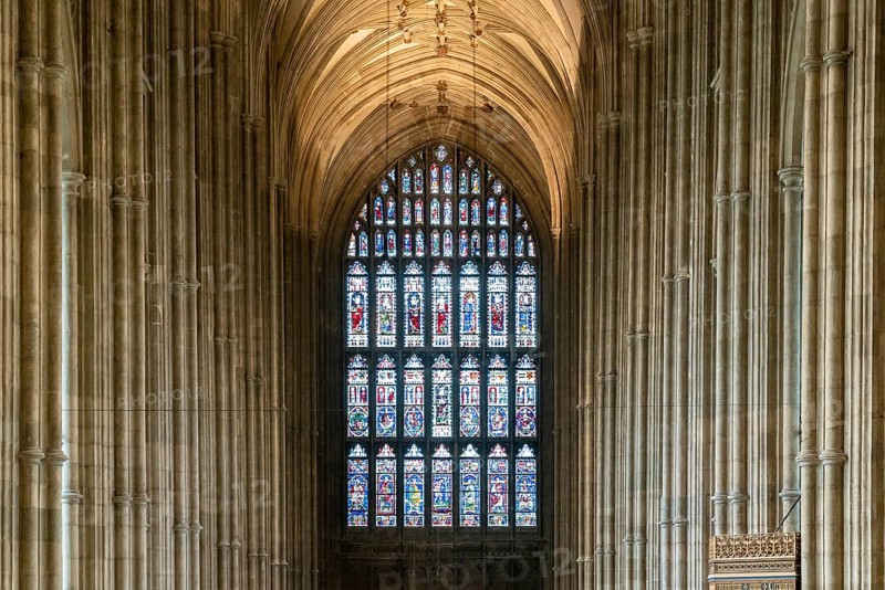 Canterbury, United Kingdom, 10 September, 2022: stained glass window and Gothic architecture columns of the central nave inside the historic Canterbury Cathedral, Europe