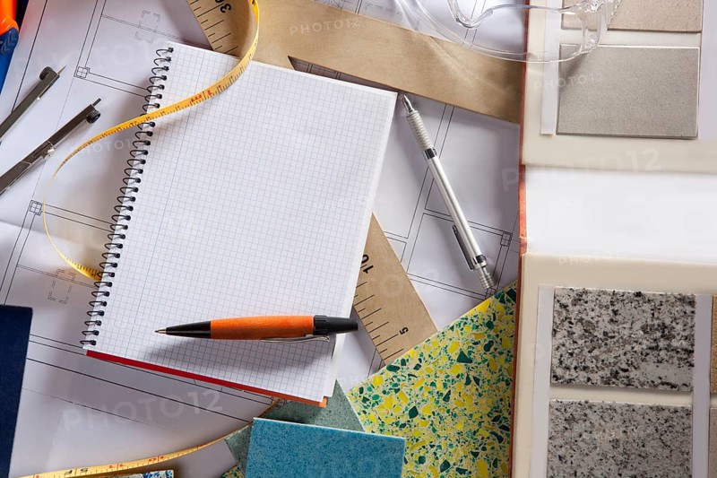 Architect or interior designer workplace desk with spiral notebook blank copy space