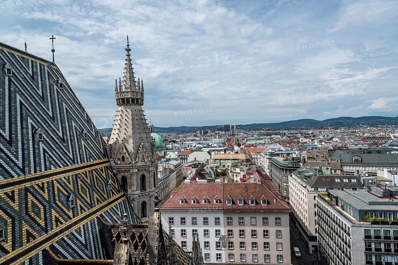 Vienna, Austria, August 16, 2017: Panoramic view of Vienna from the roof of Cathedral of St Stephen. Built in romanesque and gothic style, with its multi-coloured tile roof is a city's symbols, Europe