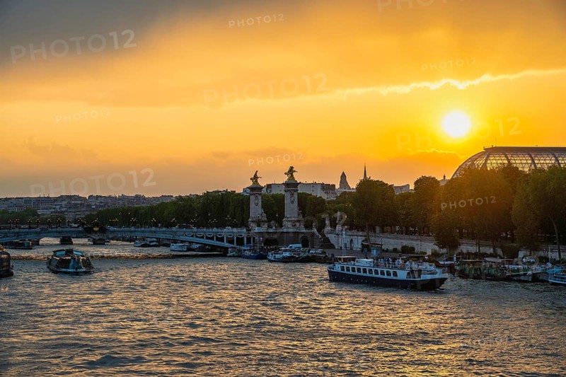 Paris France, city skyline sunset at Seine River with Pont Alexandre III bridge and Grand Palais