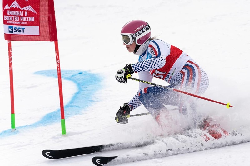 KAMCHATKA PENINSULA, RUSSIA, APRIL 2, 2019: Russian Women s Alpine Skiing Cup, International Ski Federation Championship, giant slalom. Mountain skier Kryukova Dariya Chelyabinsk skiing down mount